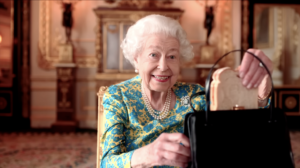 The Queen, revealing her handbag contains a marmalade sandwich